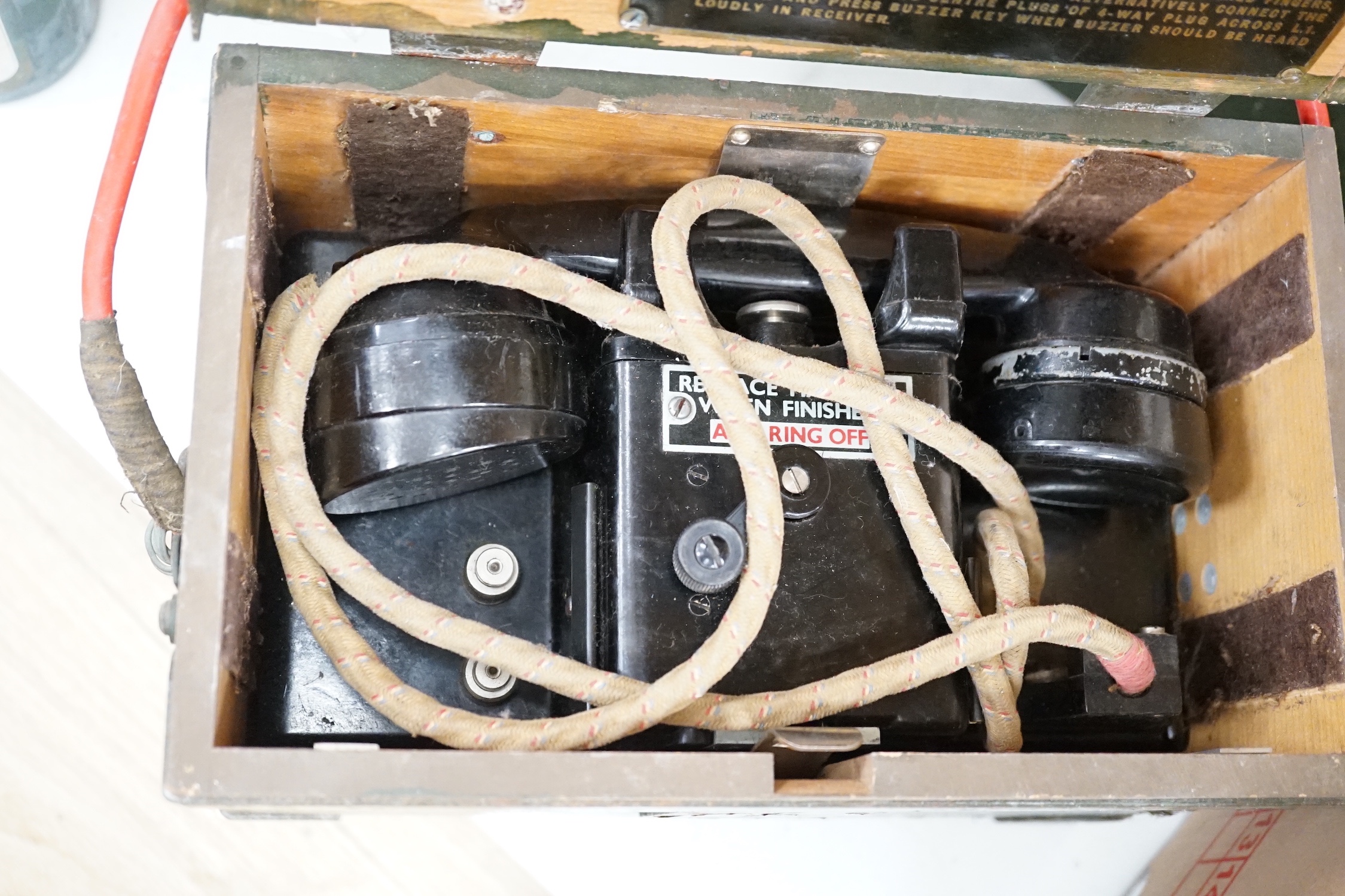 Two wooden cased military field telephones